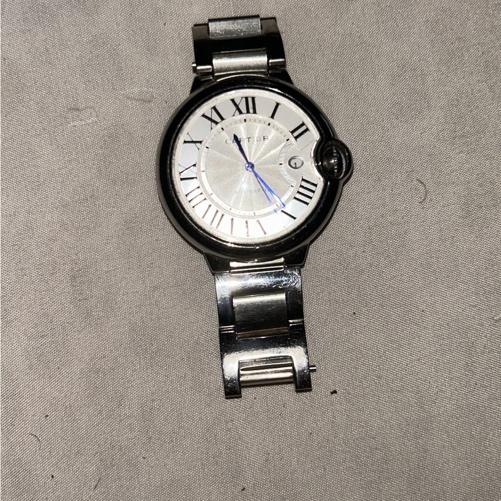 Cartier Silver Watch with Roman Numerals and Blue Hands